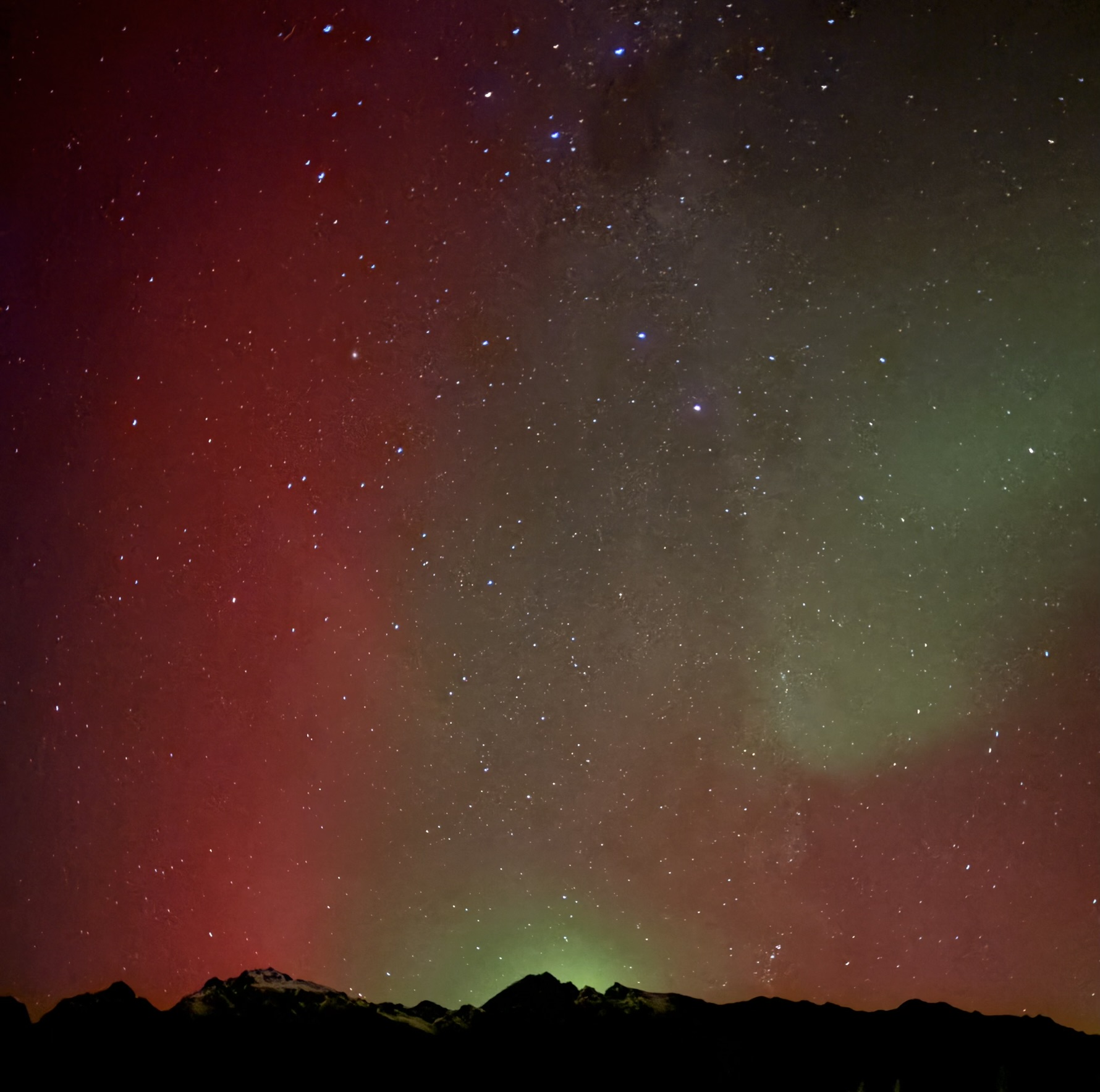 The aurora above a New Zealand mountain skyline